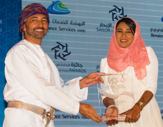 Intisar receiving award
